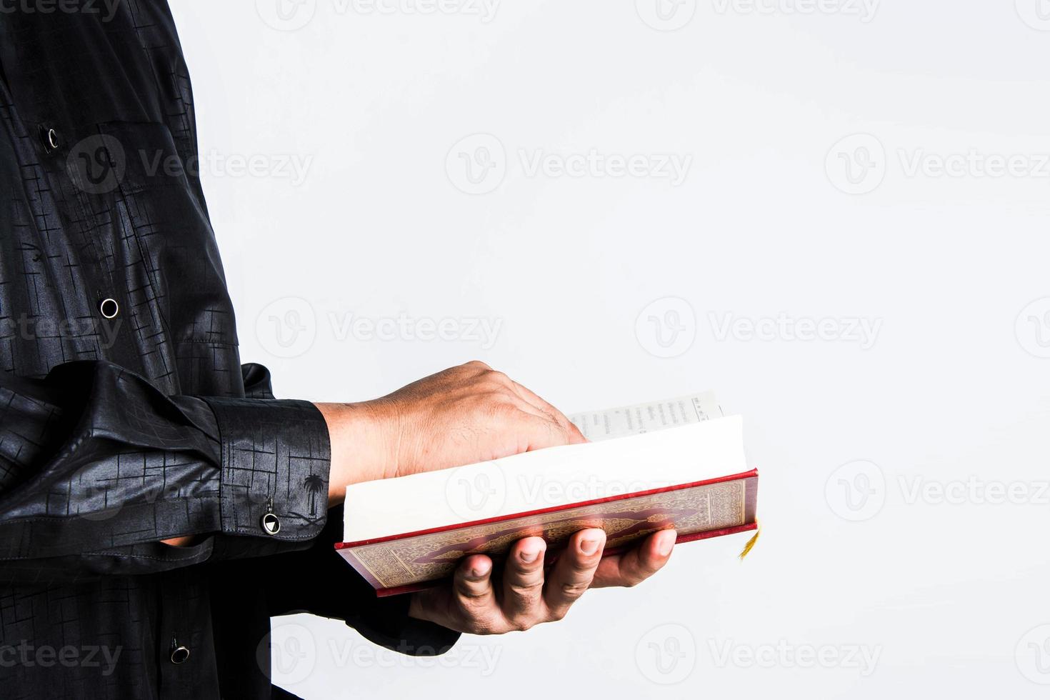Koran in hand  holy book of Muslims  public item of all muslims photo