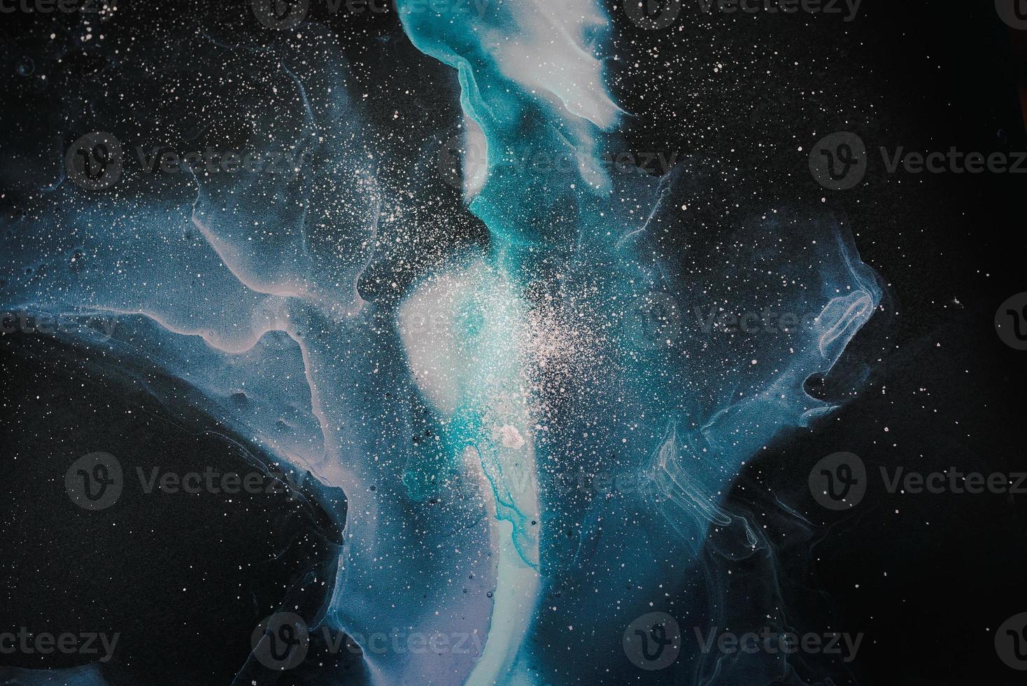 Currents of translucent hues, snaking metallic swirls, and foamy sprays of color shape the space of these free-flowing textures. The marbling techniques, alcohol ink, modern abstract painting photo