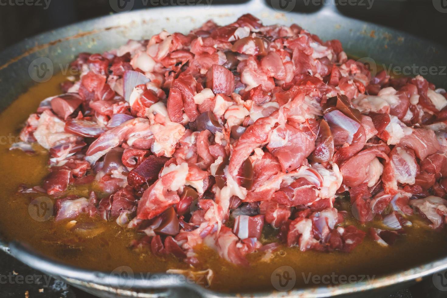 The process of cooking tongseng using a stove in close up, tongseng is traditional food from central java indonesia. thera are tongseng goat beef or chicken photo