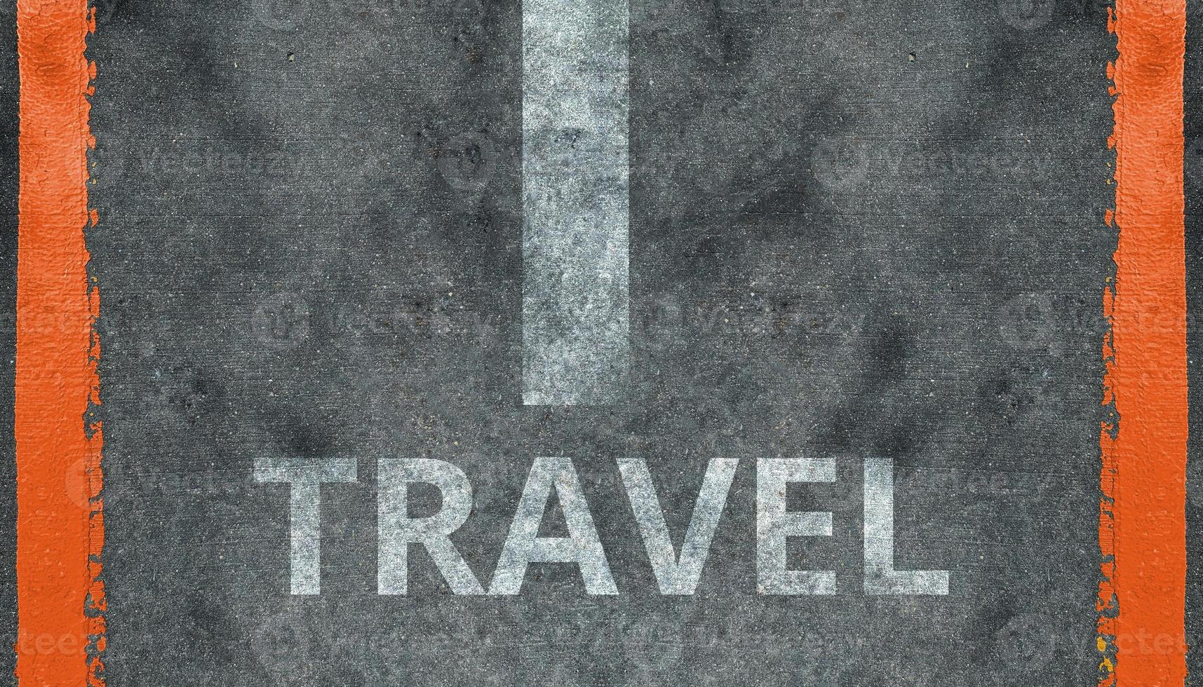 Travel background, text travel on the asphalt photo