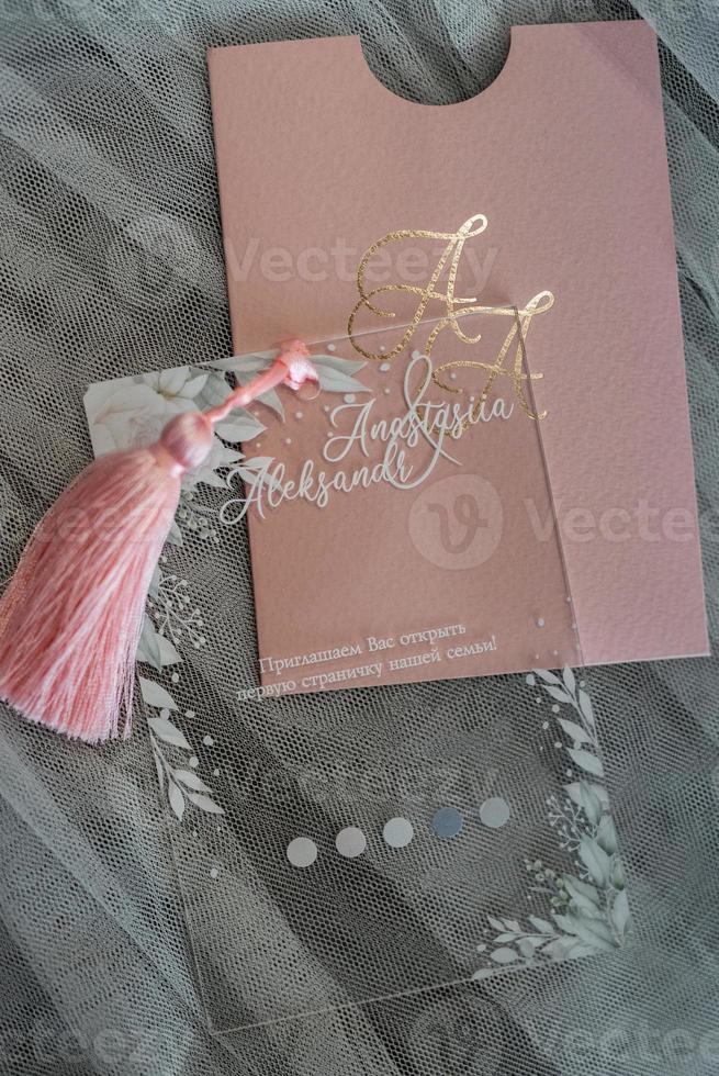 wedding invitation in a gray envelope on a table photo