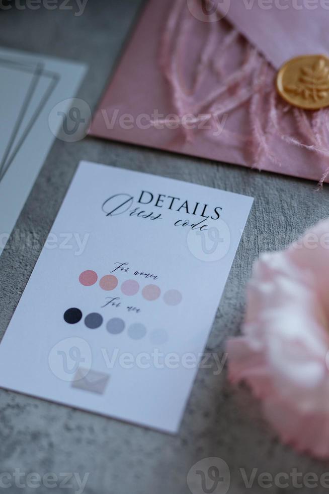 wedding invitation in a gray envelope on a table photo