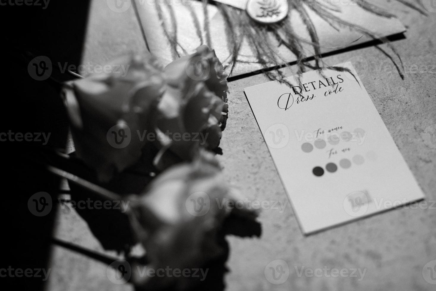 wedding invitation in a gray envelope on a table photo