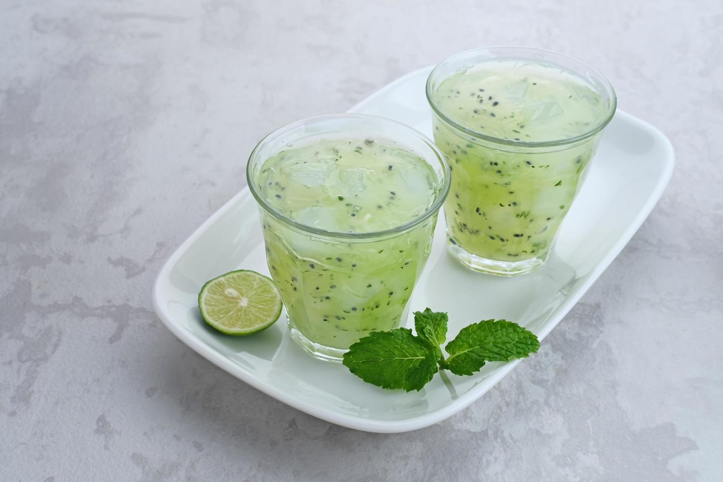 Es Timun Serut, a typical Indonesian drink made from shaved cucumber with syrup, lime and basil seeds. Popular during ramadan. photo