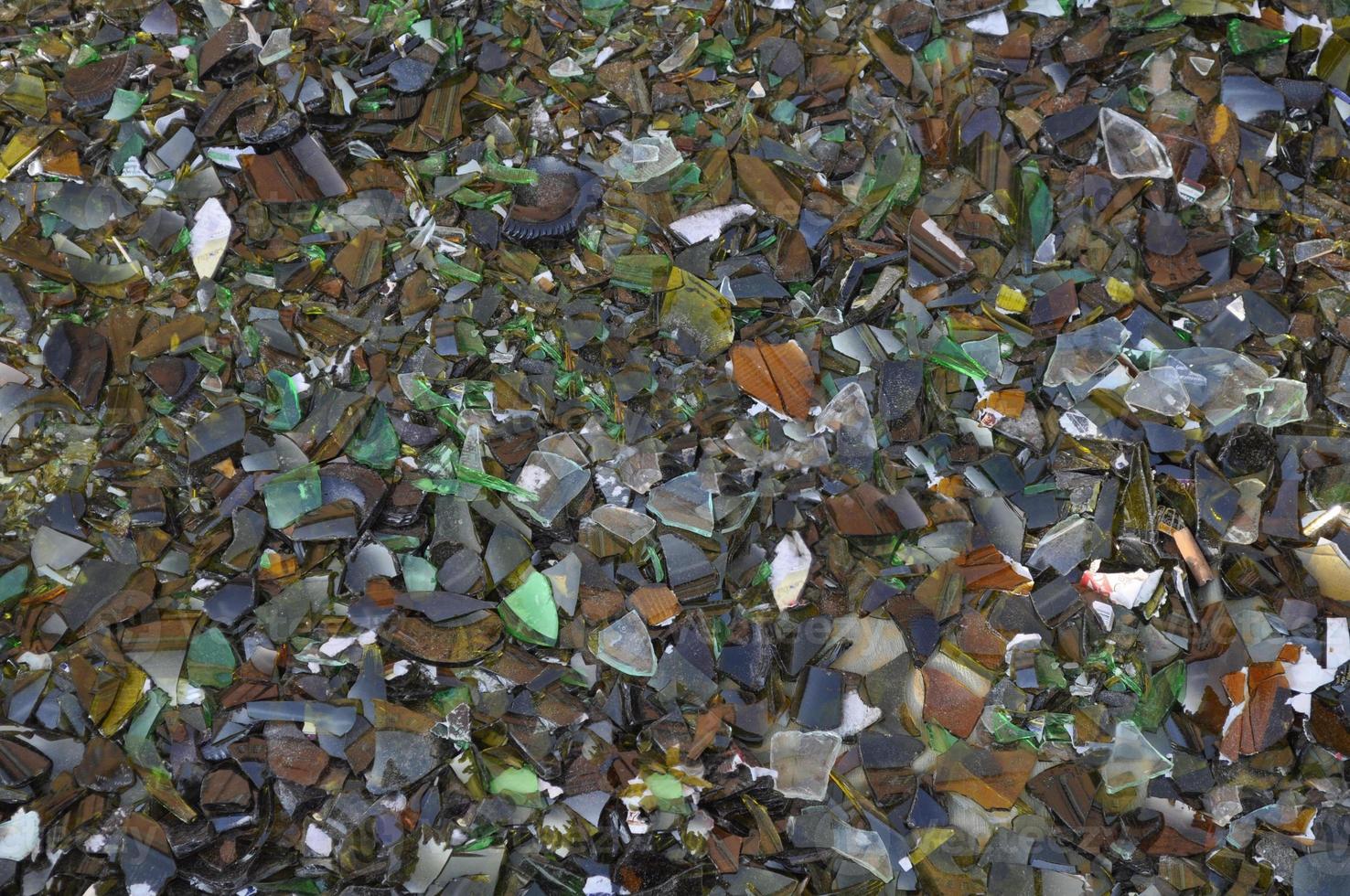 Waste sorting - Broken glass bottle pieces useful as a backgroun photo