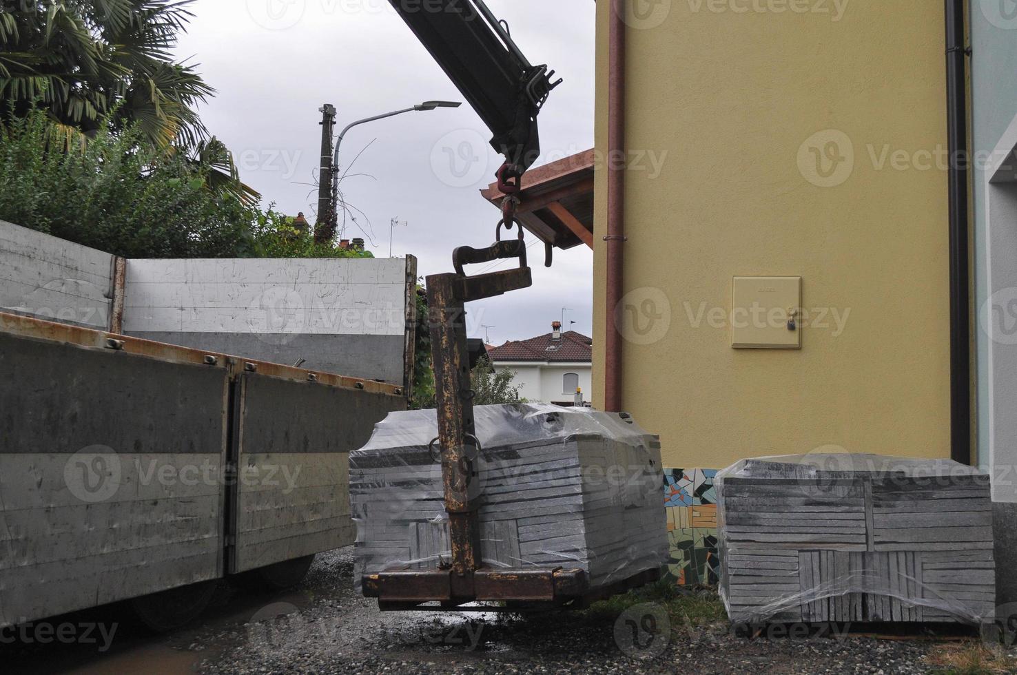 loading or unloading of stone tiles photo
