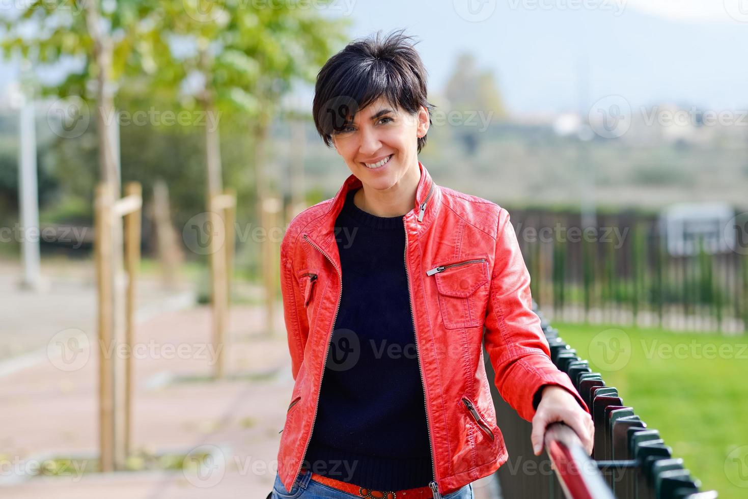 Mid aged woman wearing casual clothes outdoors photo