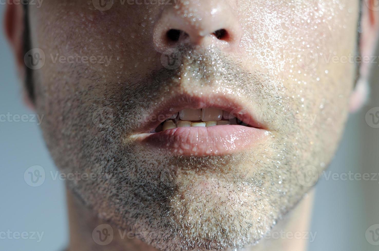 Closed portrait of a man with water drops photo