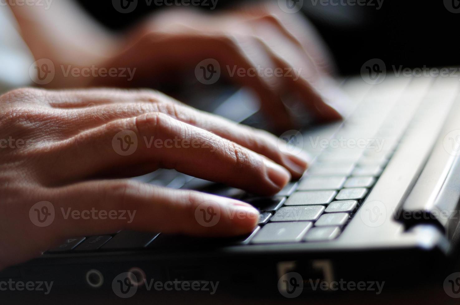 Typing female hands photo