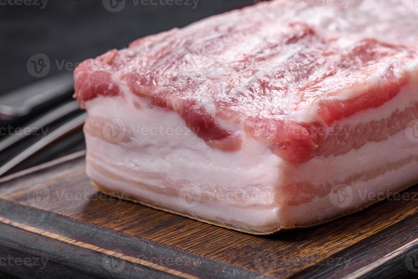Close-up fat Salted lard homemade lard on a wooden board photo