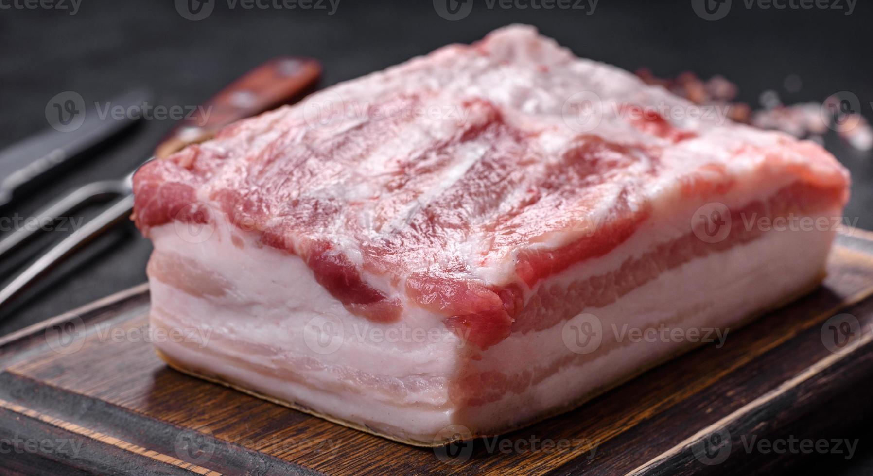 Close-up fat Salted lard homemade lard on a wooden board photo