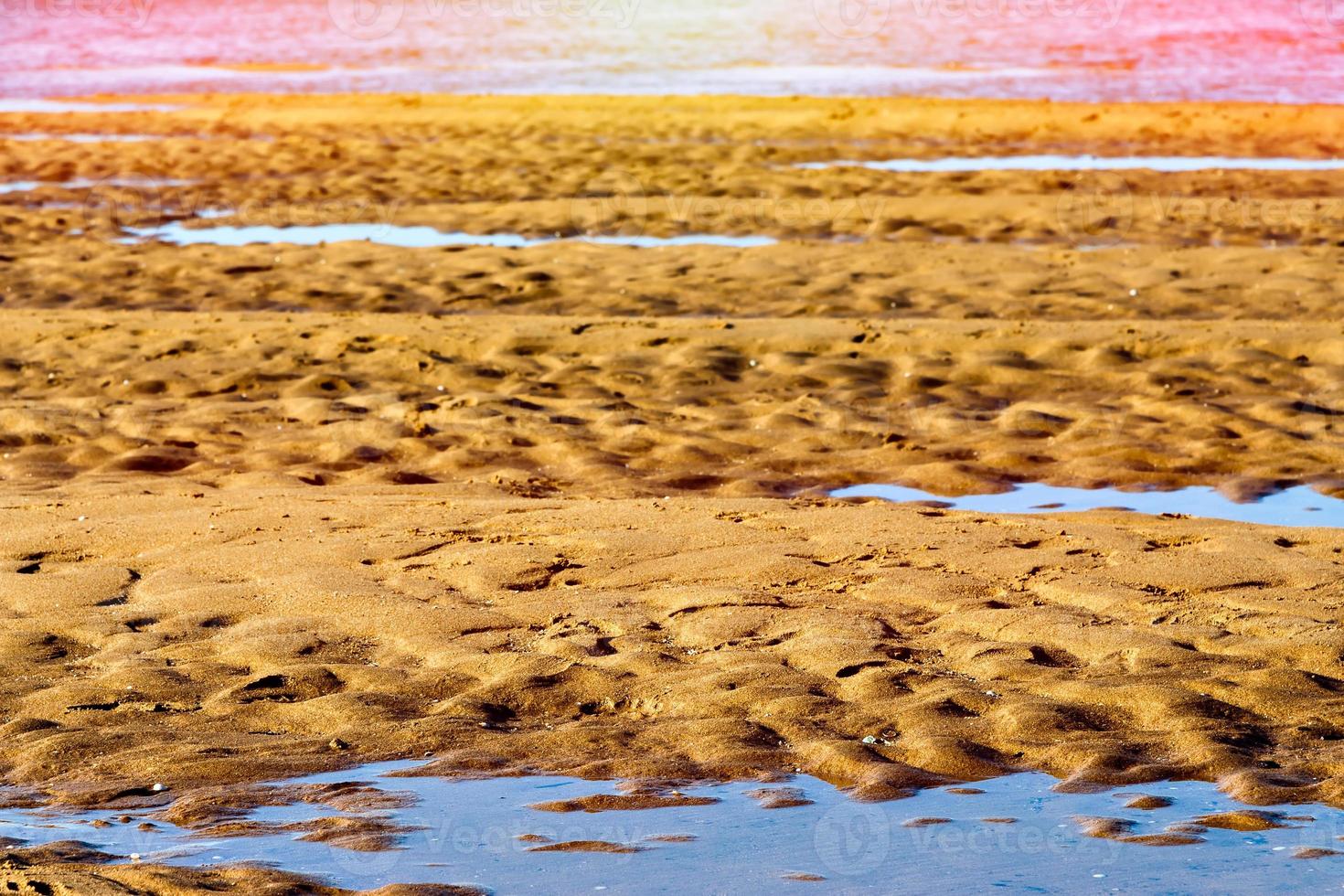 Sand after low tide on a beach in Cantabria, Spain. Horizontal image. photo