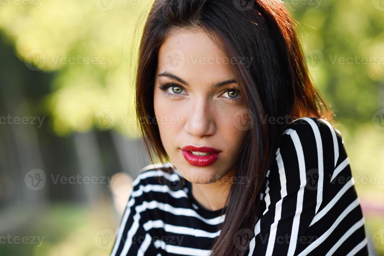 Young woman with green eyes wearing young clothing photo