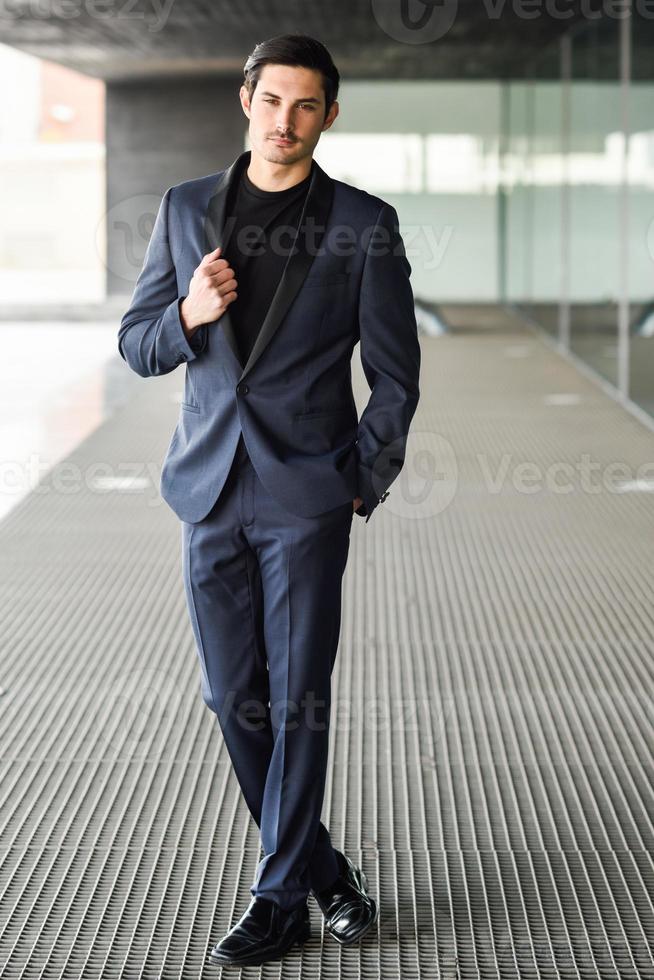 Handsome man, model of fashion, wearing modern suit. photo
