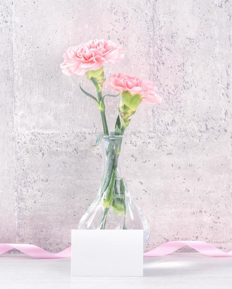 Mothers day handmade giftbox surprise wishes photography - Beautiful blooming carnations with pink ribbon box isolated on gray wallpaper design, close up, copy space, mock up photo