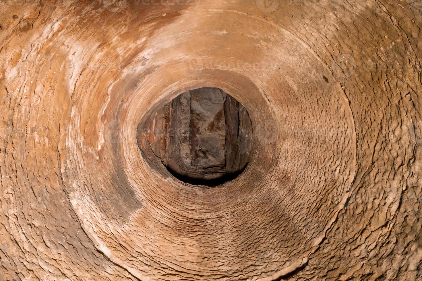 View upwards from a well shaft made of sandstone photo