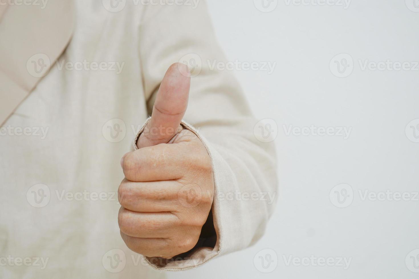 Close-up showing thumb-up expressing positive estimation.Approval concept photo