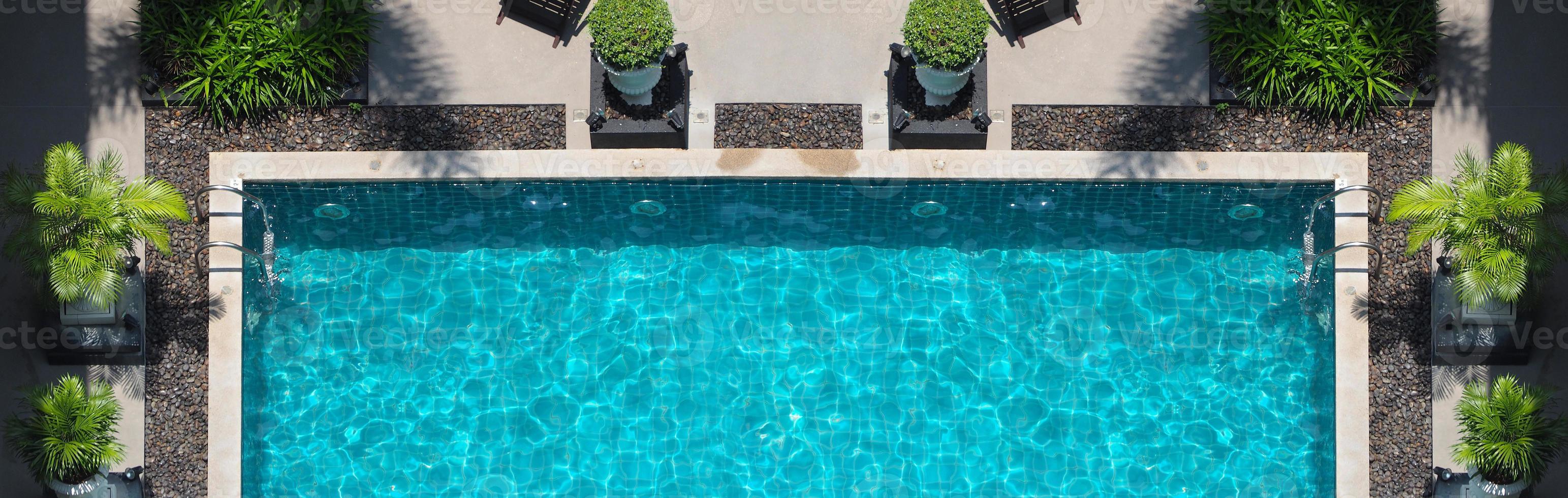 Aerial view images of swimming pool in a sunny day. photo