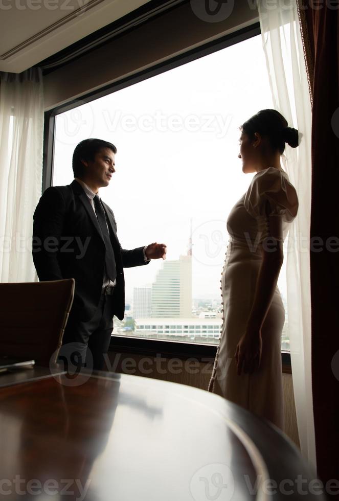 Two businessmen chat and follow up in their office photo