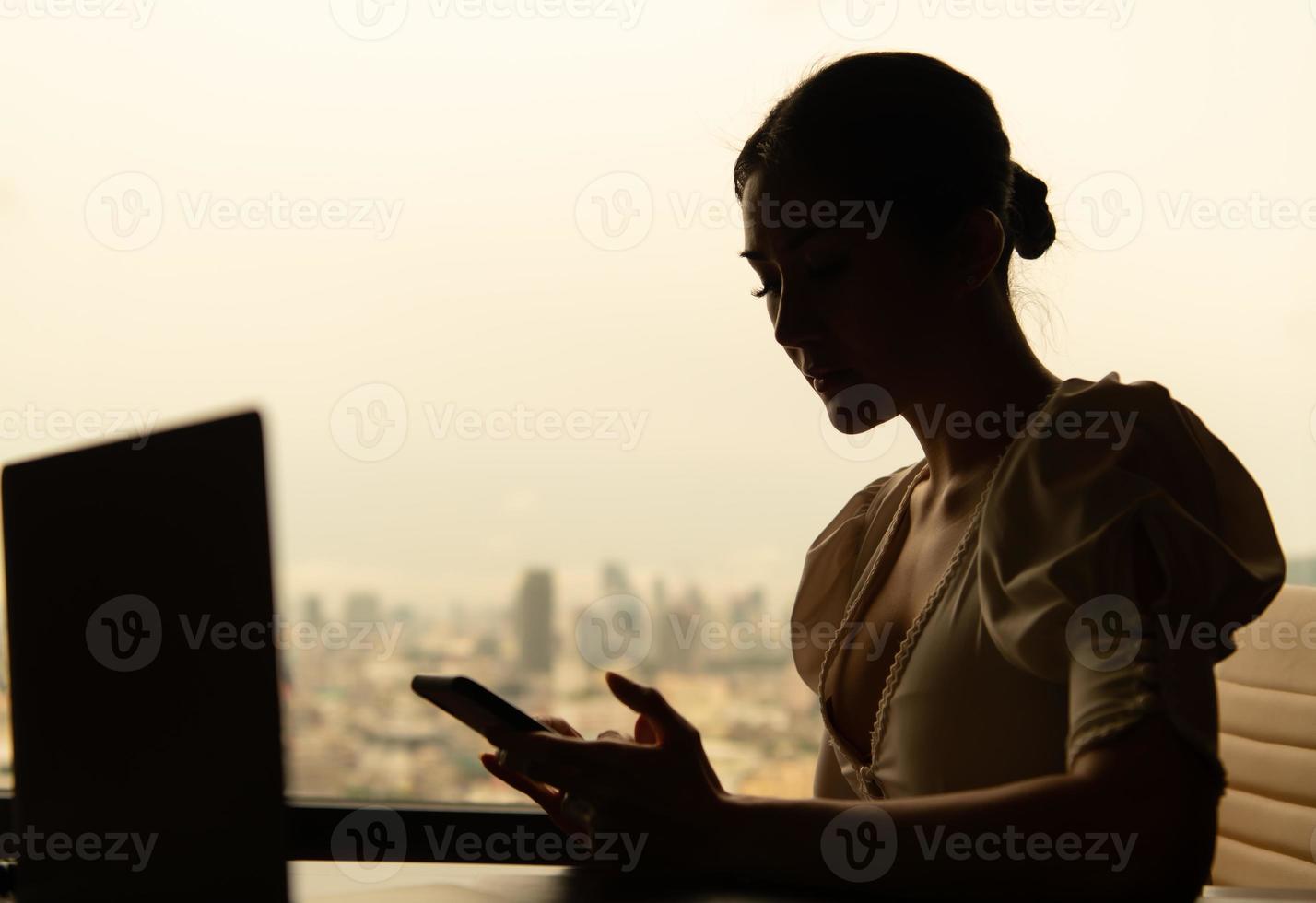 A young businesswoman who travels all over the world to do business. must stay and live in a hotel as a place to relax photo