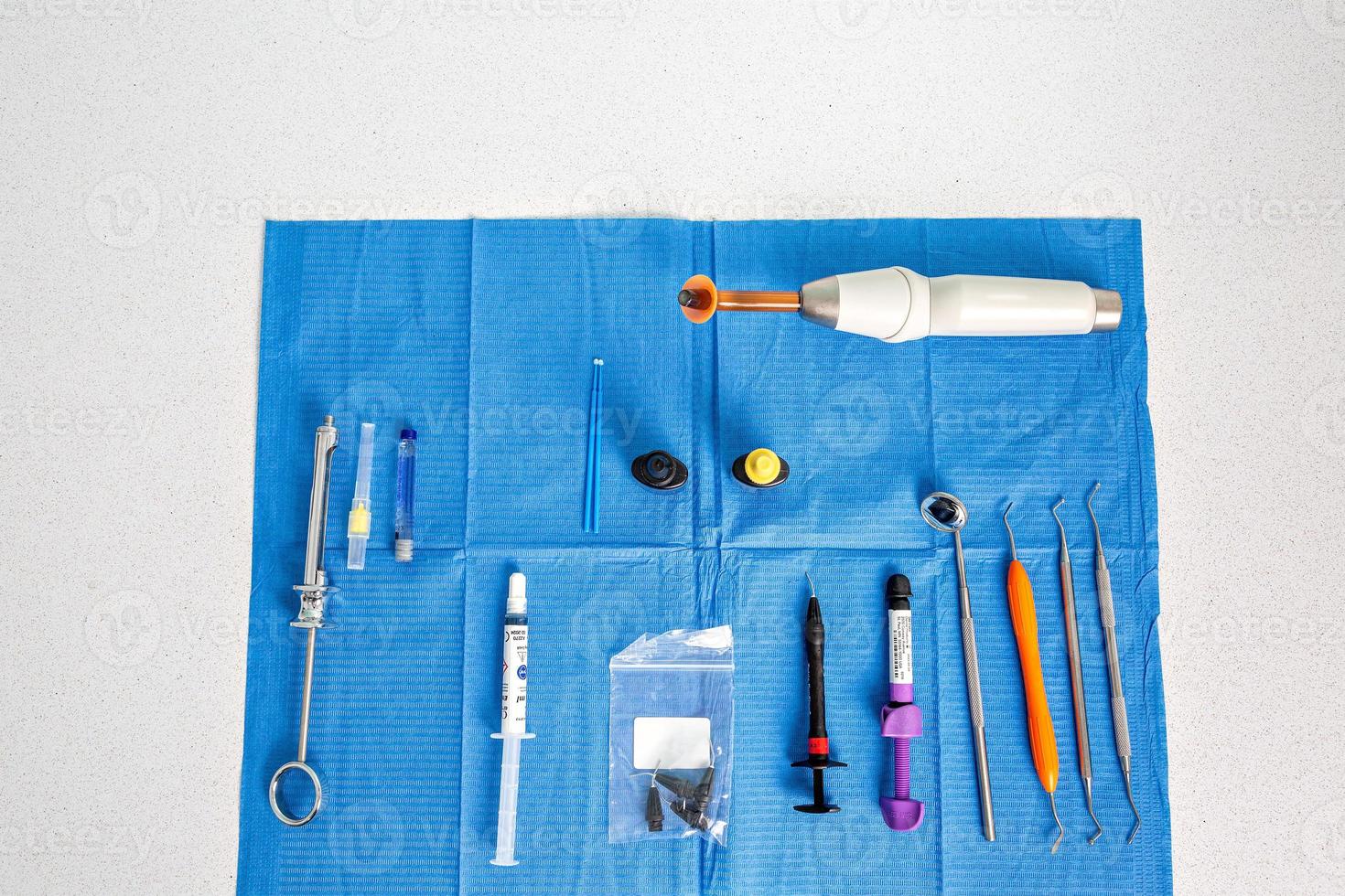 Aerial view of a table with a sterile tablecloth with tools for a dentist photo