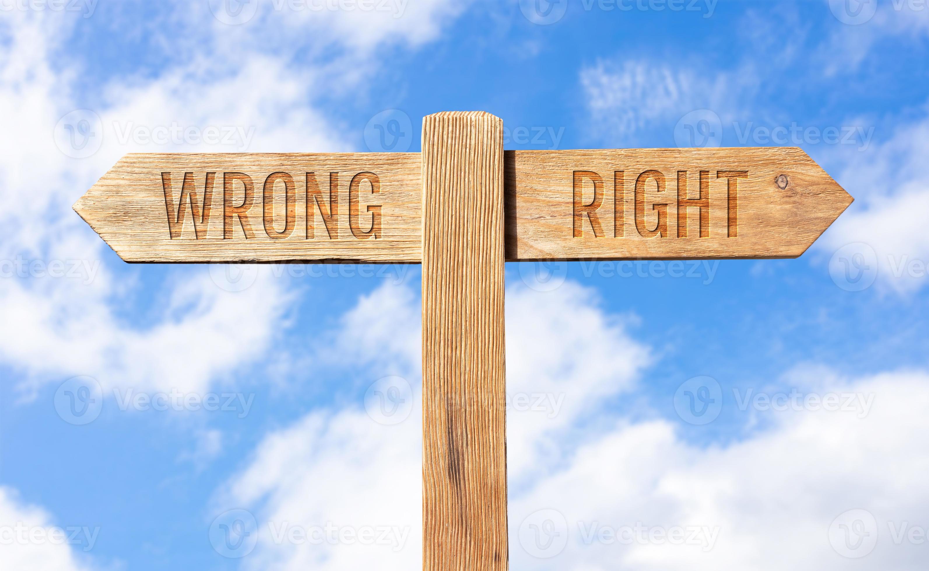 Wrong or right concept. Wooden signpost with message on sky background