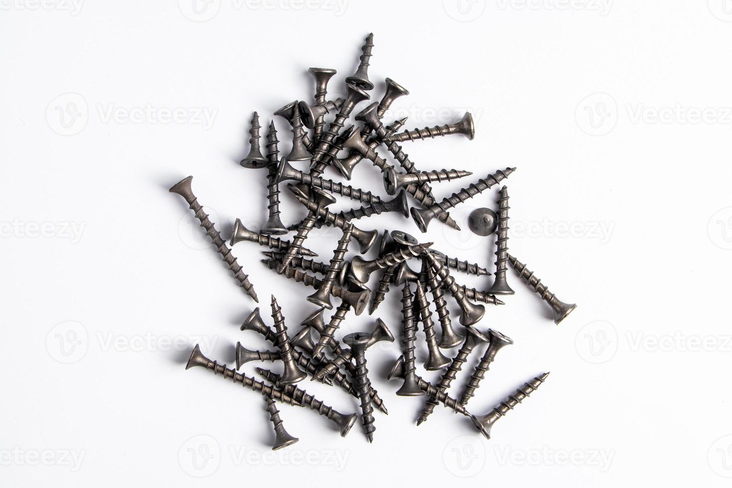 Metal screws on a white background. photo