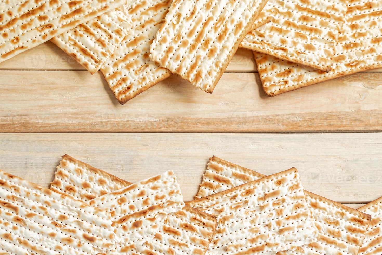 Background for the traditional Jewish holiday Pesach. Passover matzo bread on a wooden table. photo