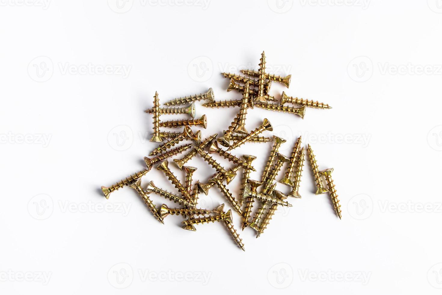 Metal screws on a white background. photo