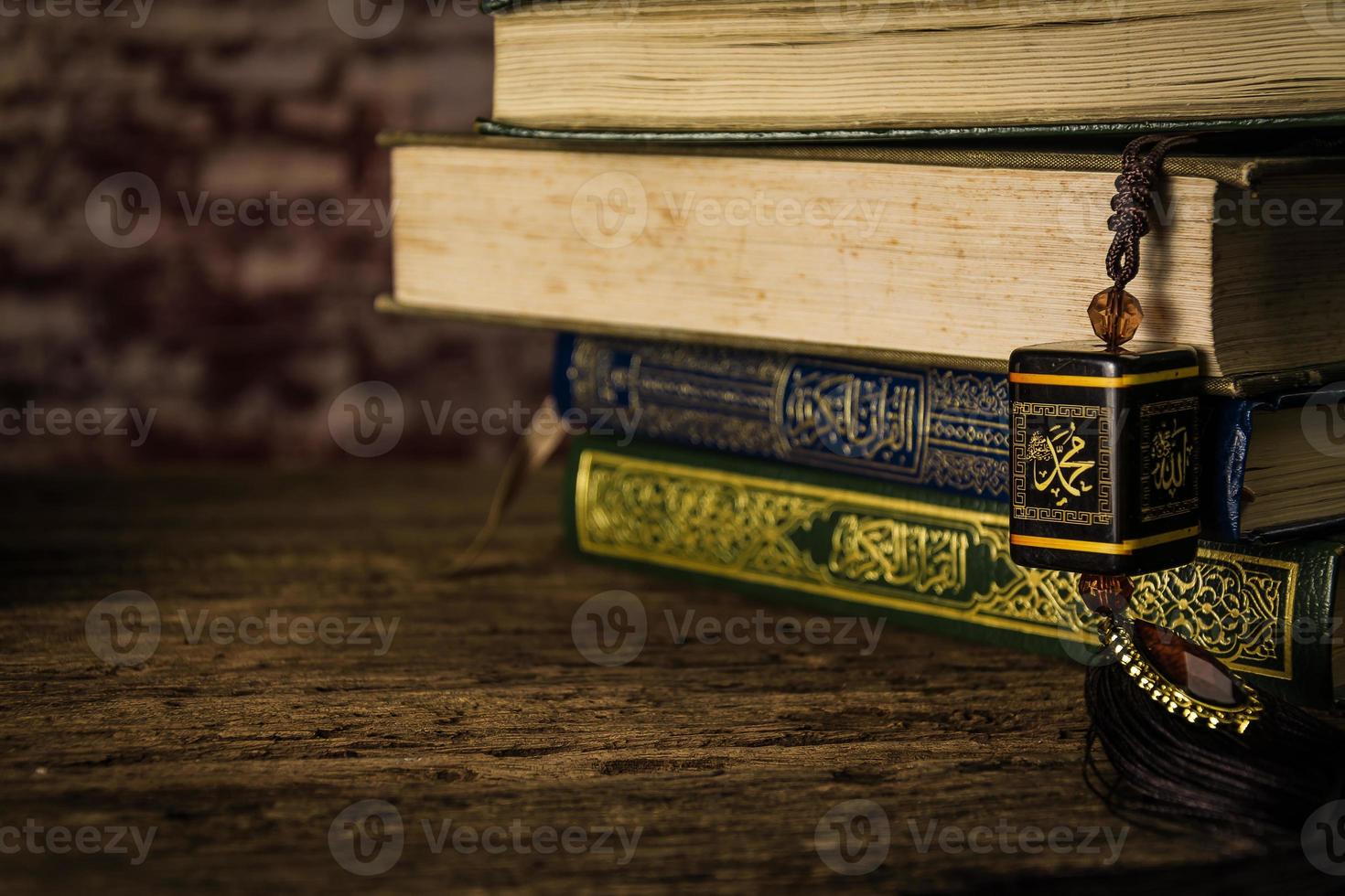 muhammad prophet of Islam with Koran  holy book of Muslims  public item of all muslims  on the table , still life photo