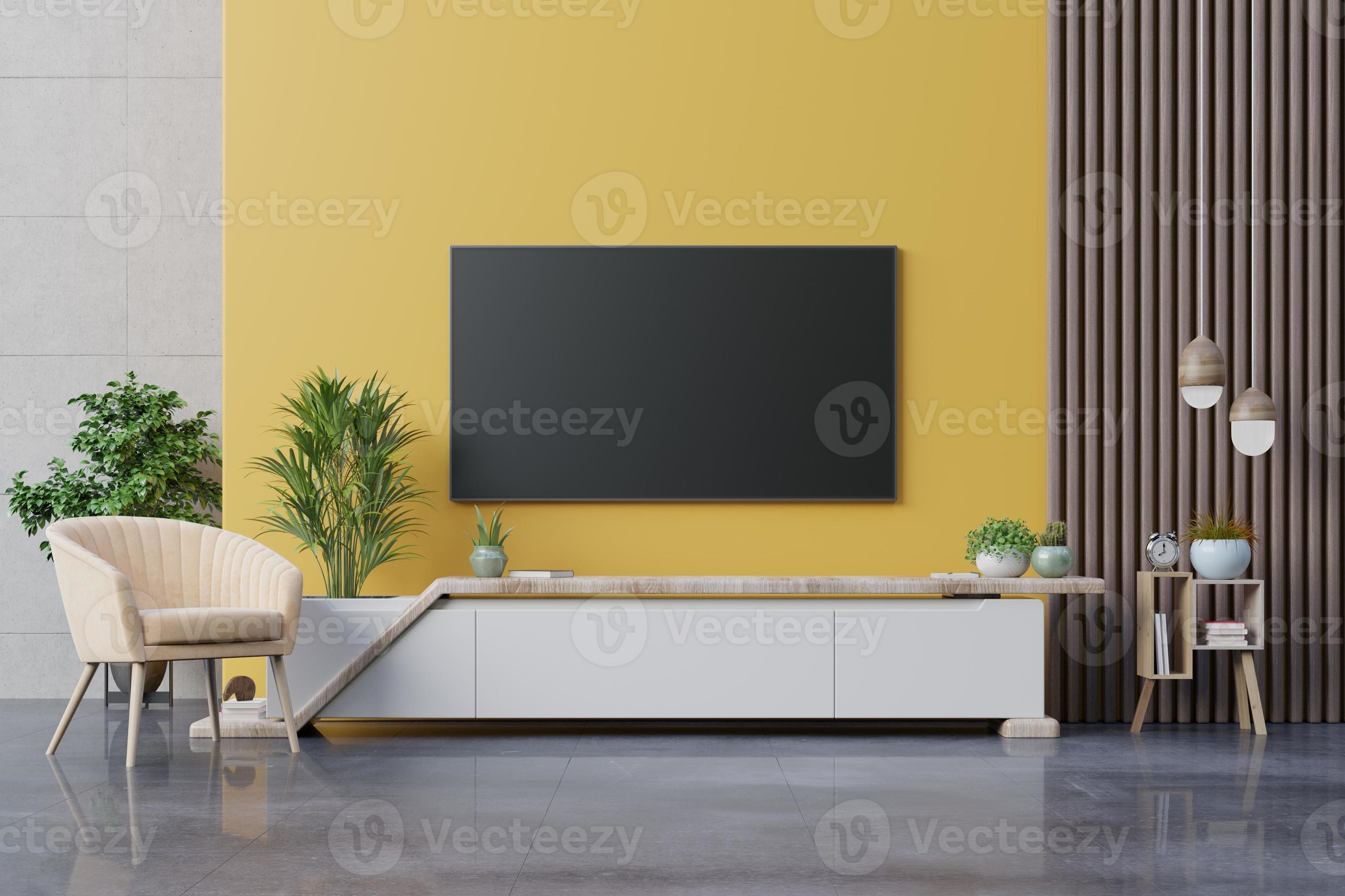 Living room led tv on yellow wall with armchair and cabinet tv on yellow  wall background. 6532872 Stock Photo at Vecteezy