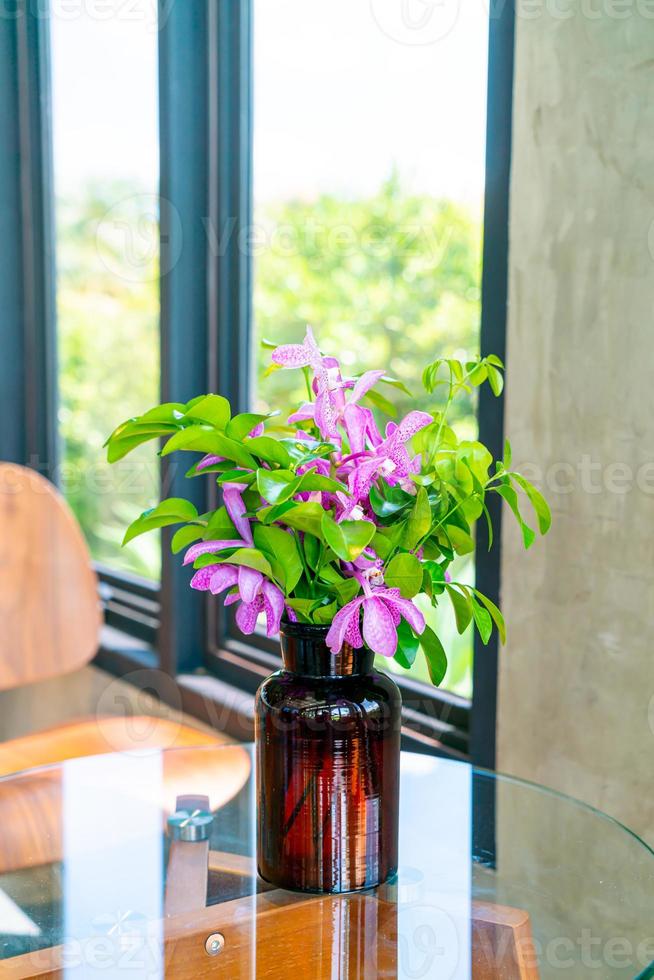 orchid flowers in vase photo