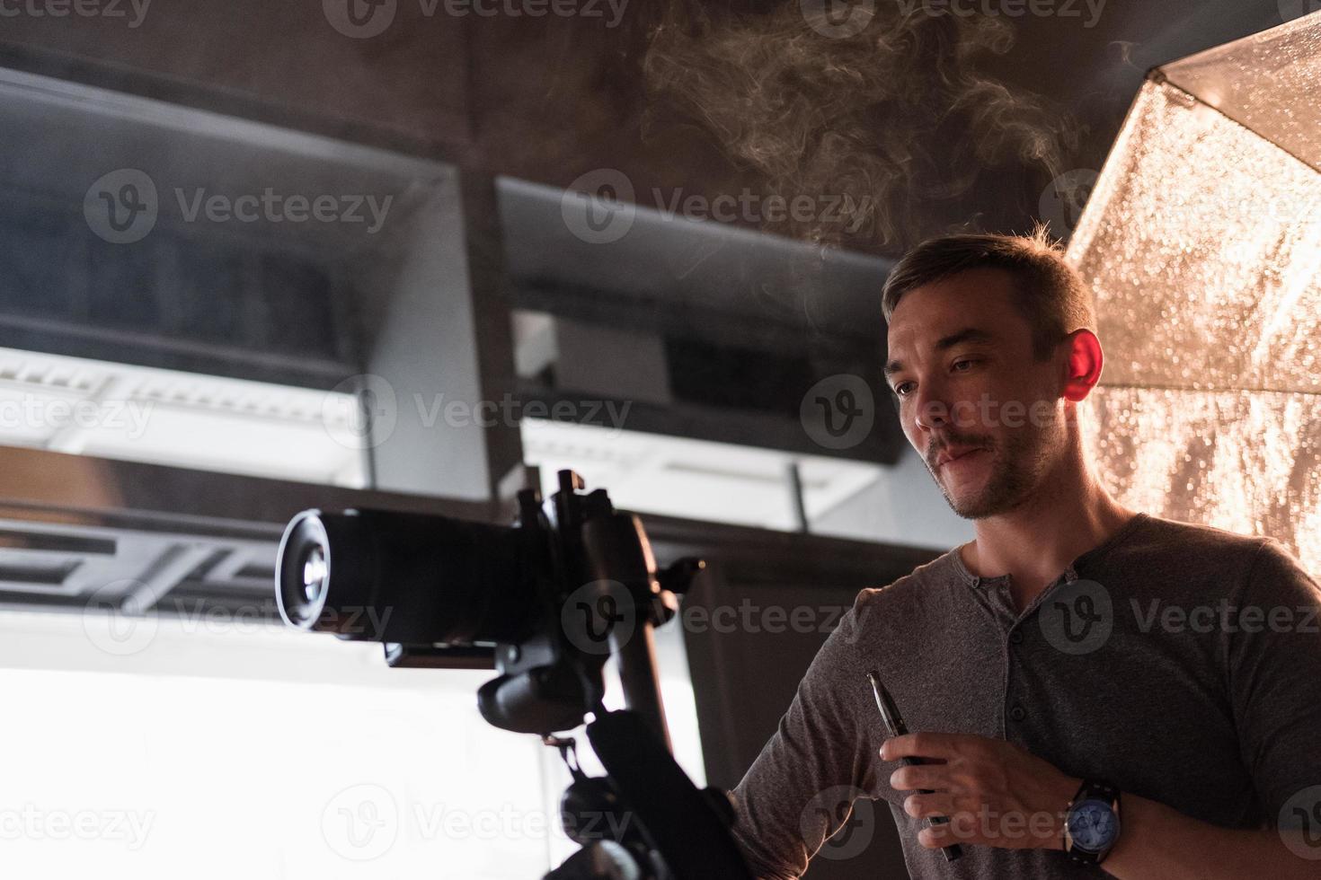 photographer in the process of shooting in the Studio photo