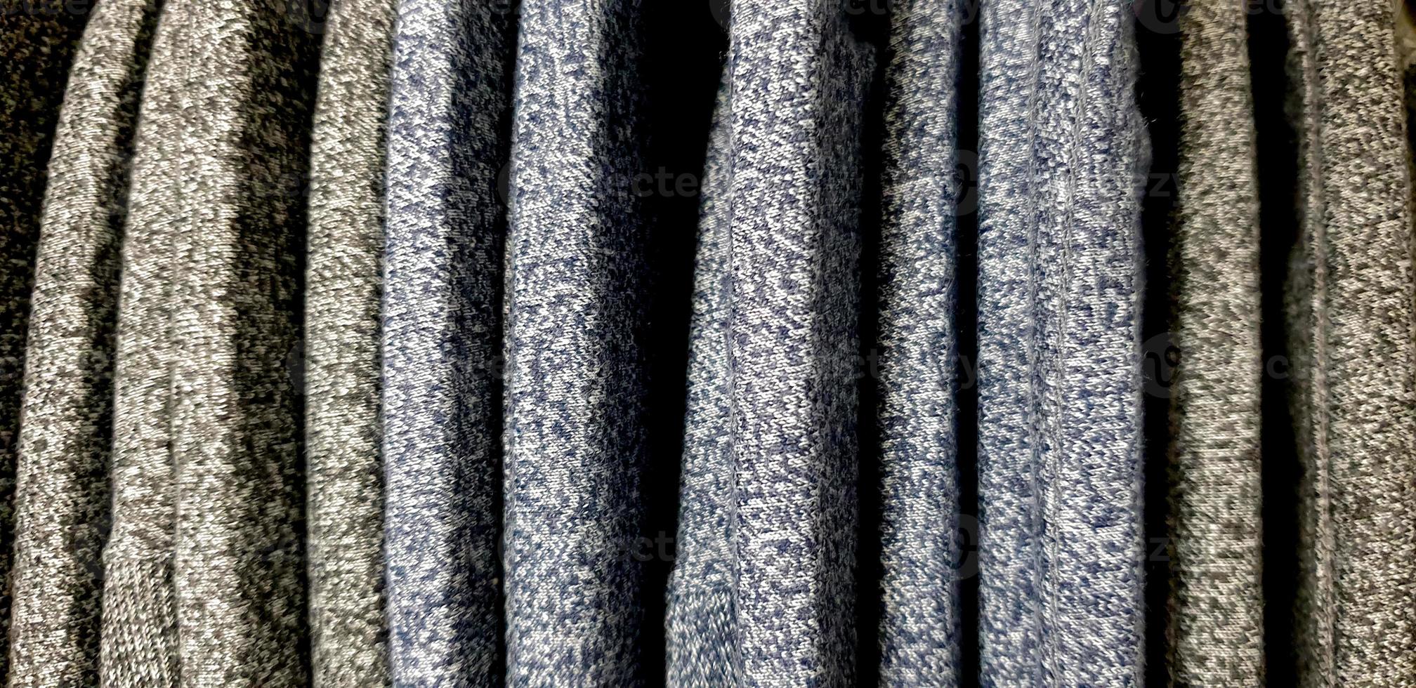 various patterns of soft fabric texture. background with copy space for image or text. Fabric swatches are stacked for selection photo
