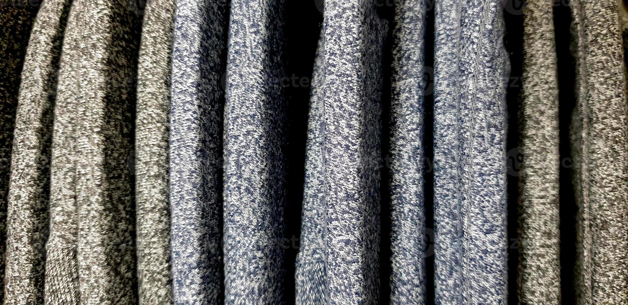 various patterns of soft fabric texture. background with copy space for image or text. Fabric swatches are stacked for selection photo