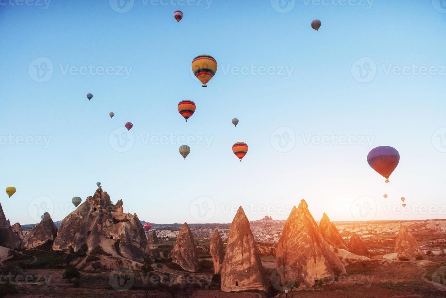 Amazing sunset over Cappadocia. Beautiful color balloons. Turkey photo