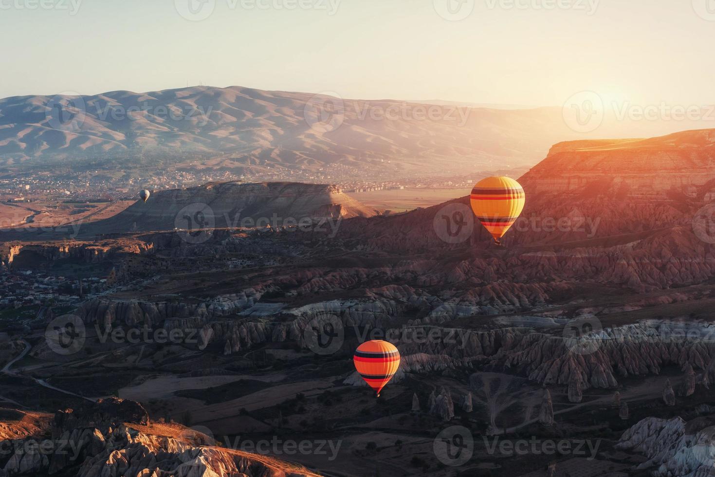 Amazing sunset over Cappadocia. Beautiful color balloons. Turkey photo