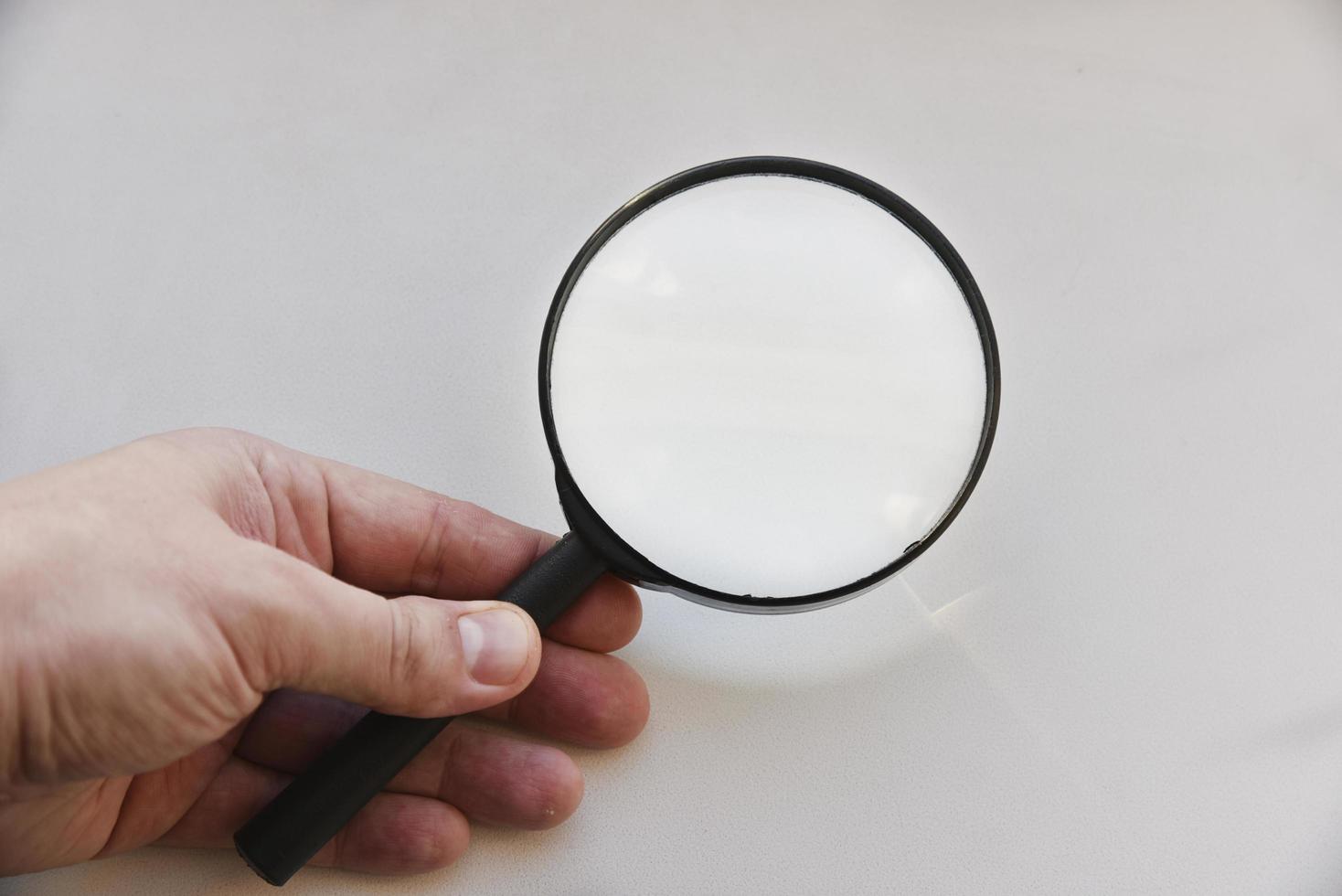 Large magnifying magnifier on a white background photo