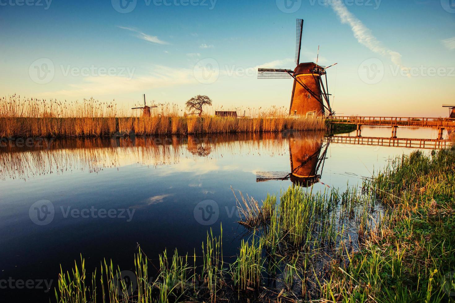 Traditional Dutch windmills from the channel Rotterdam. Holland. photo