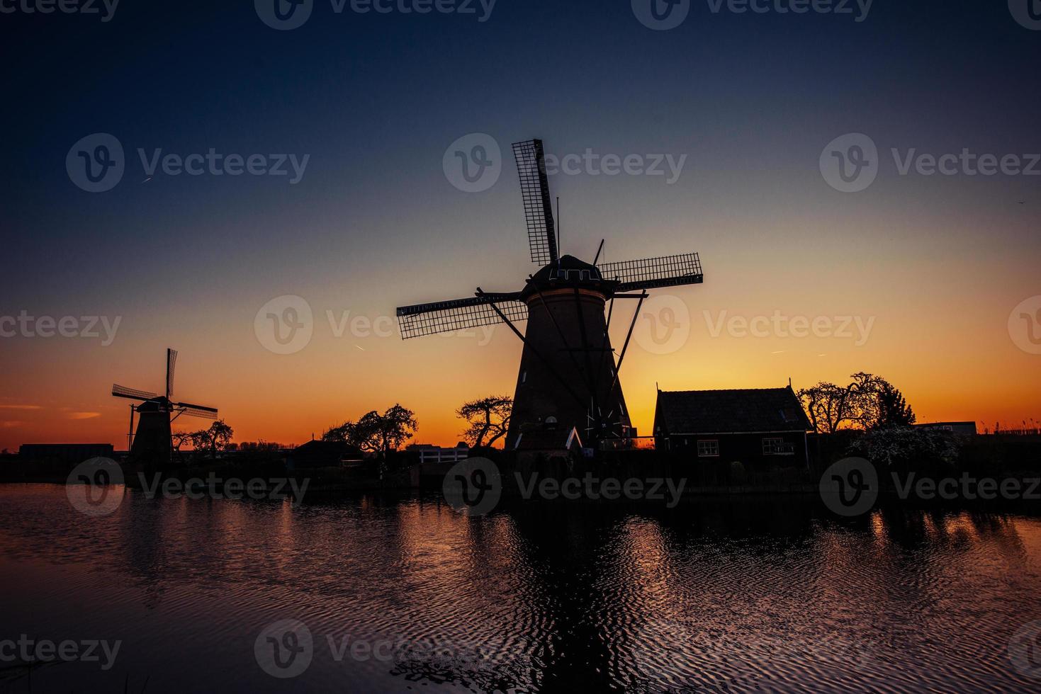 Starry sky over Dutch mills photo