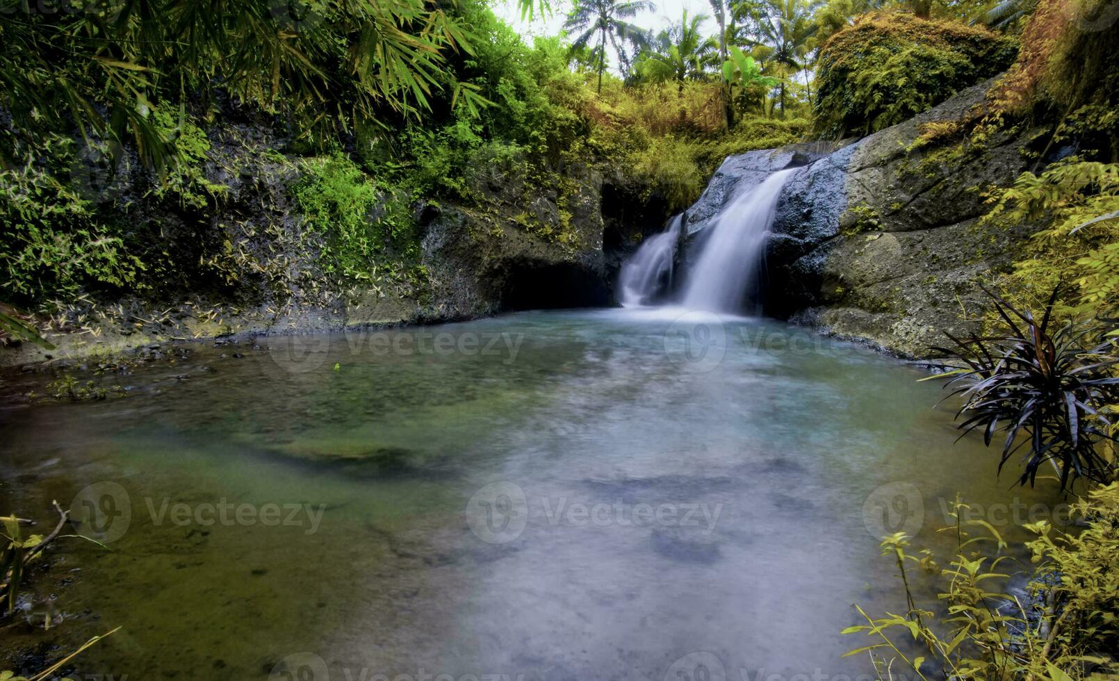 Erorjo hidden waterfall in a forest photo