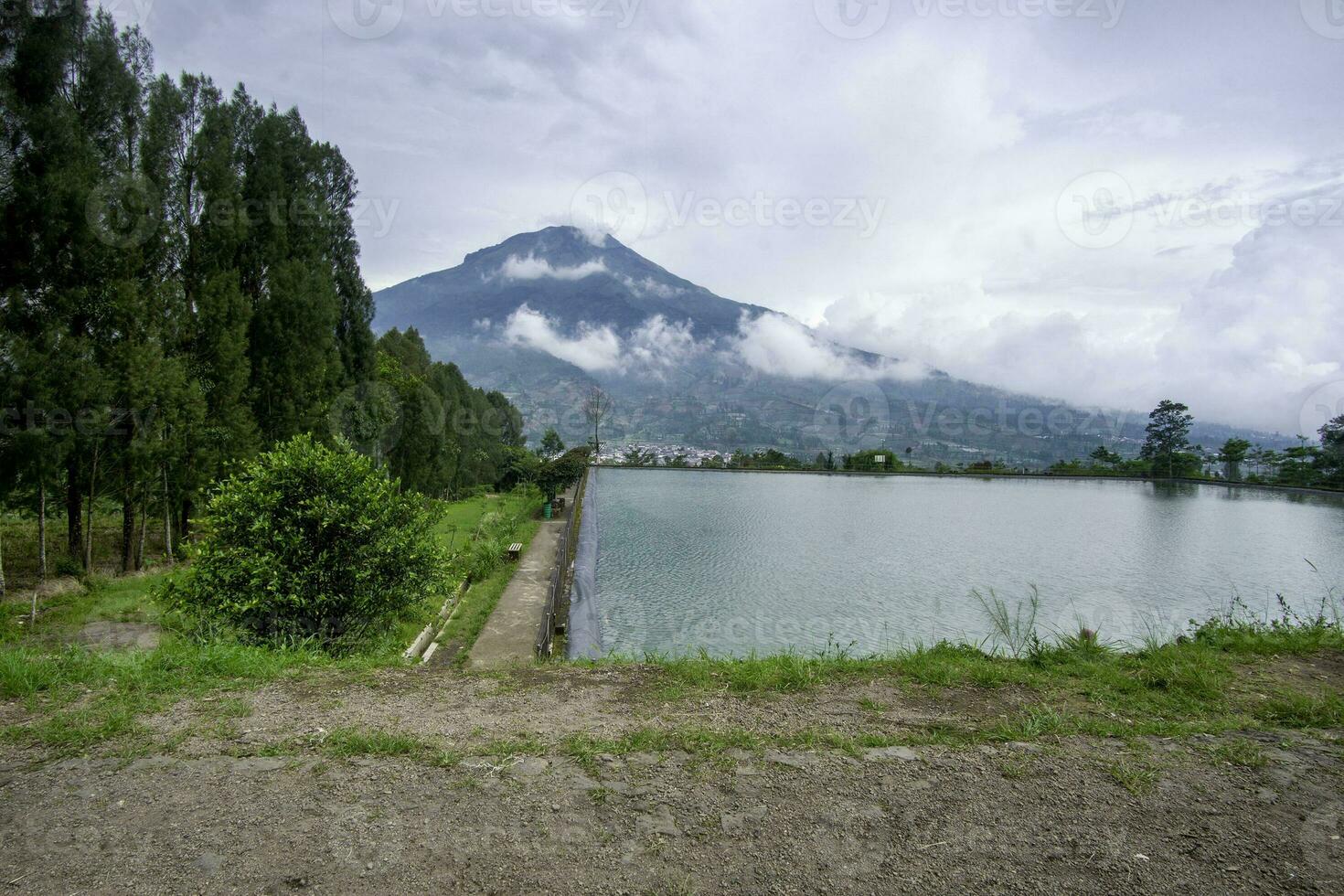 Misty mountain view at Embung Kledung Wonosobo Indonesia photo