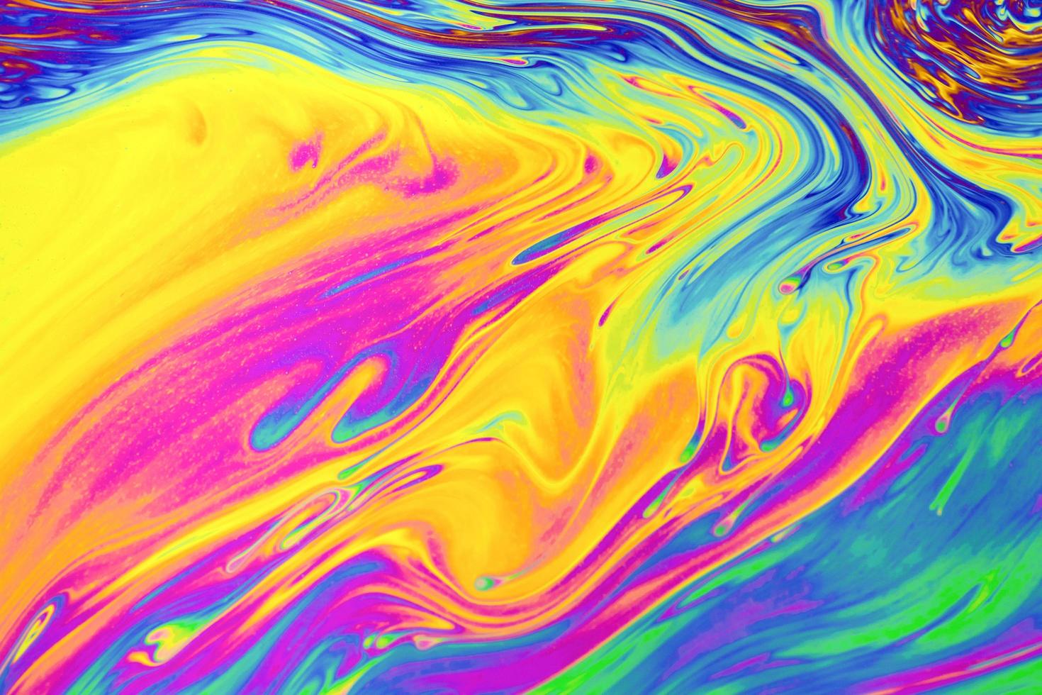 Rainbow colors. Psychedelic multi colored patterns background. Photo macro shot of soap bubbles