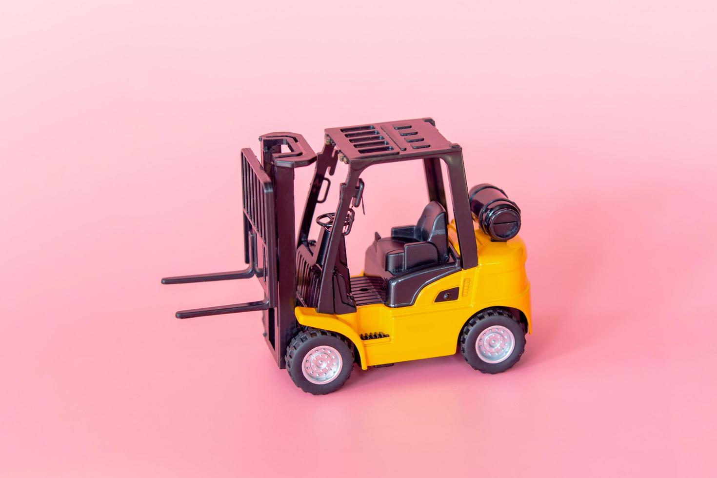 Logistics, and delivery service - Forklift model on Pink background. Shopping service on The online web and offers home delivery. photo