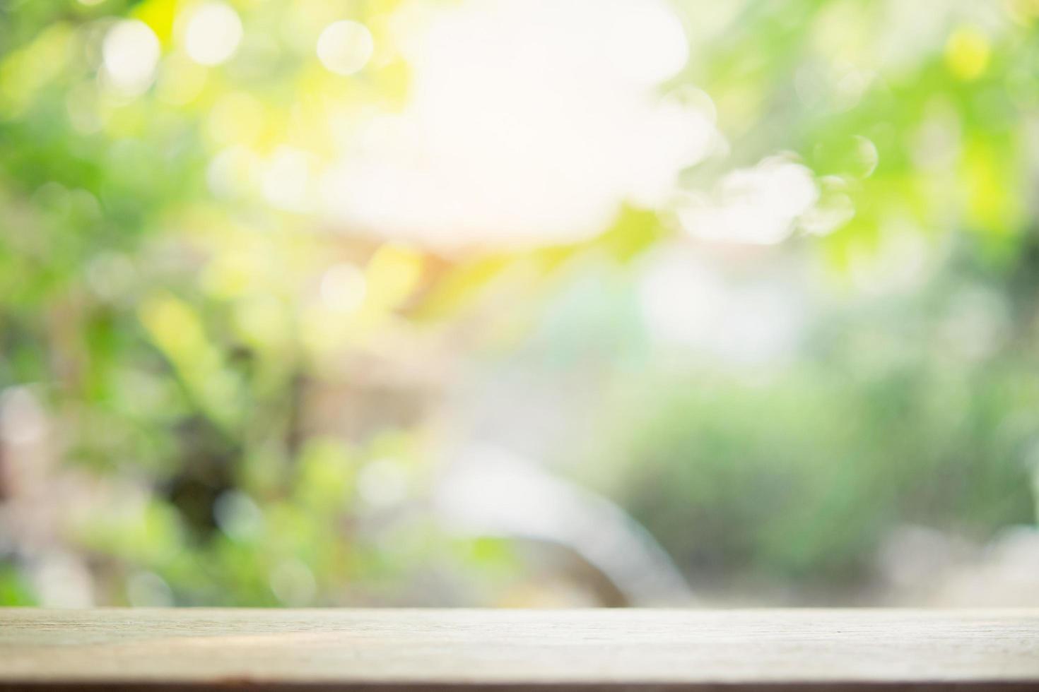 Empty wood table top and blur nature background with copy space for display or montage your products photo