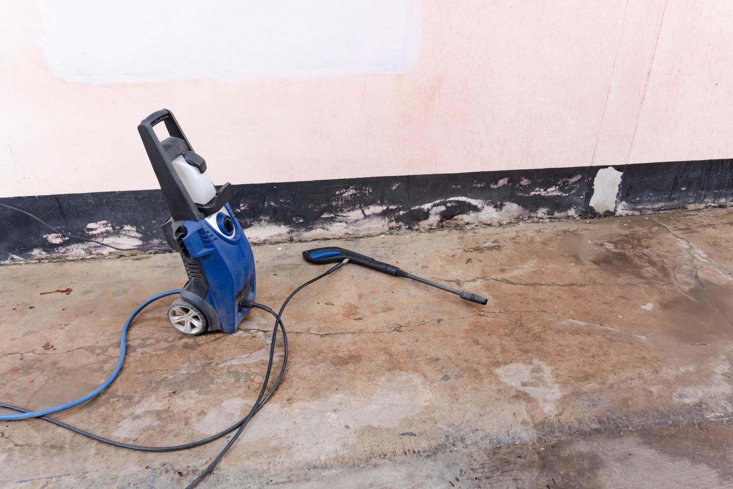 High pressure washer on concrete floor photo