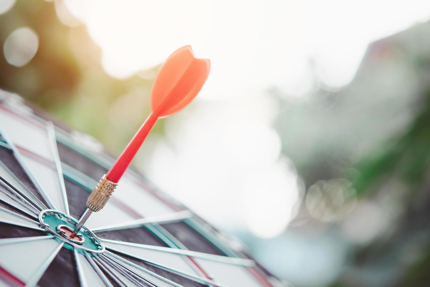 Business marketing success concept. Red dart arrow in center of the target dartboard. Bullseye is a target of business. photo