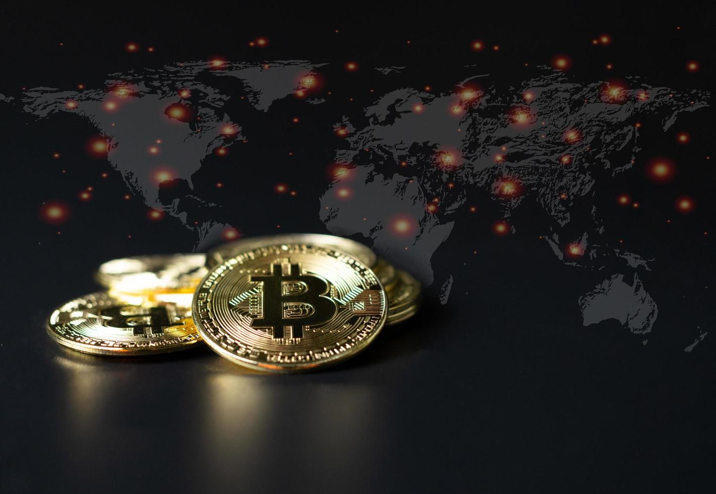 Bitcoin Coins as Cryptocurrency placed on a black background photo