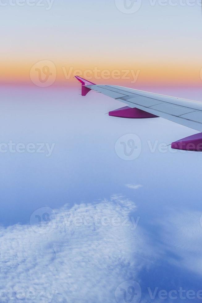 Wing aircraft and a view of cumulus clouds photo