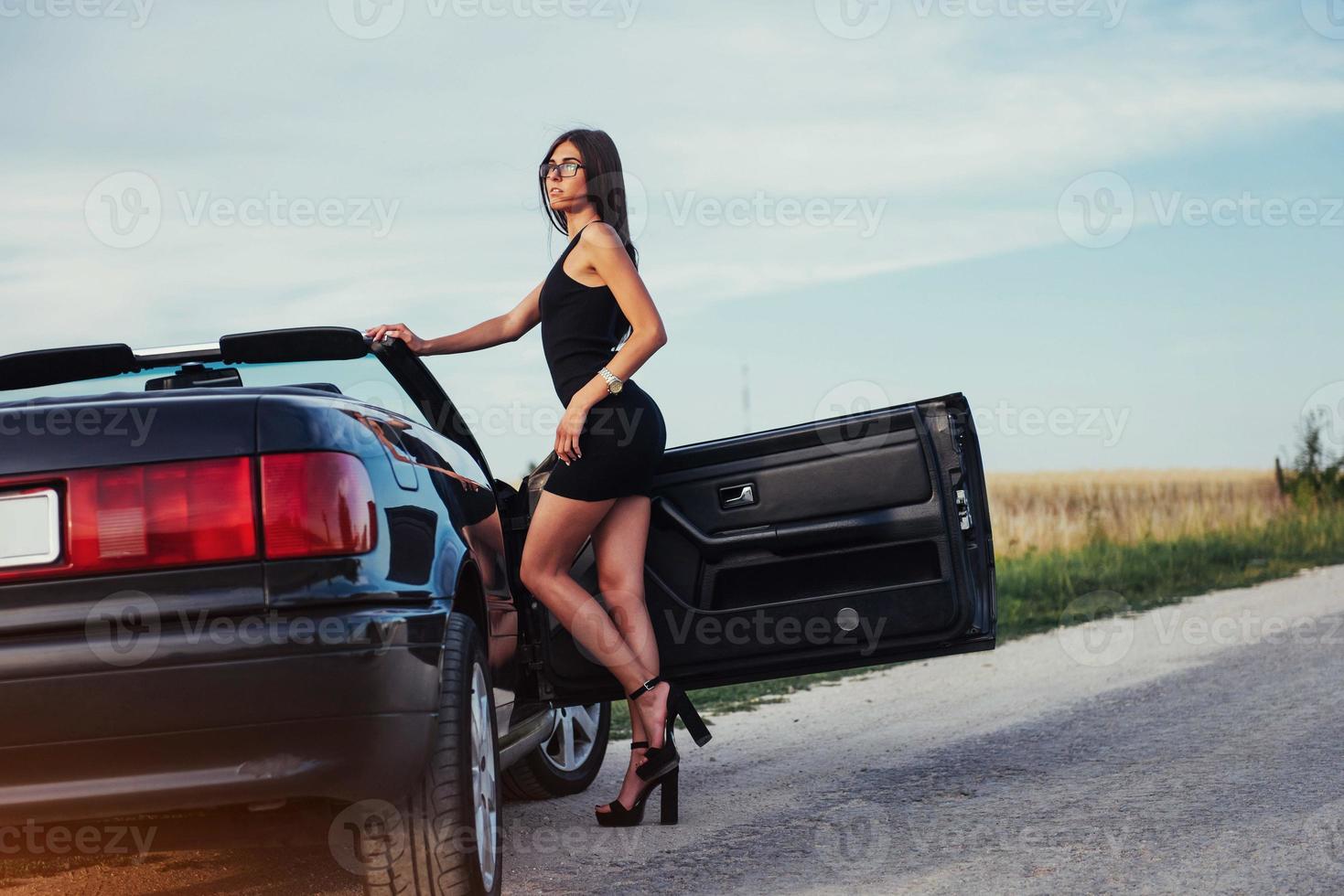 young woman in a photo shoot. She gladly posing